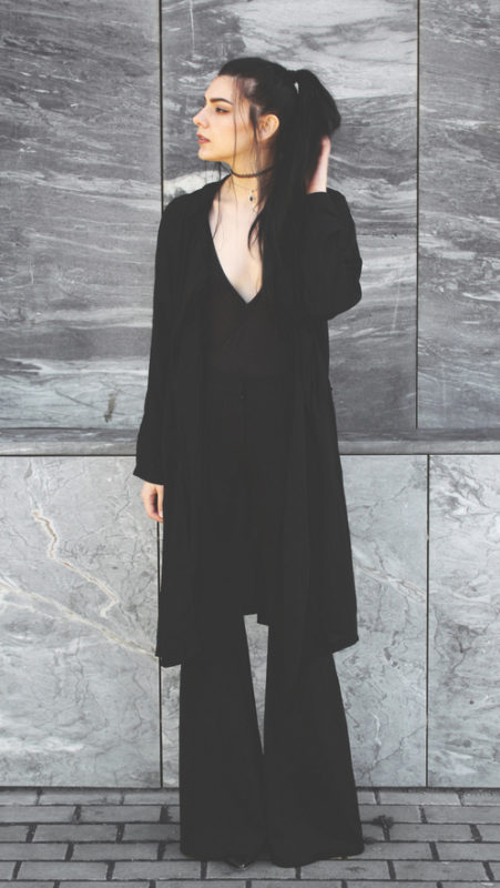 Deep-V-bodysuit-with-a-chiffon-coat-and-black-flare-pants
