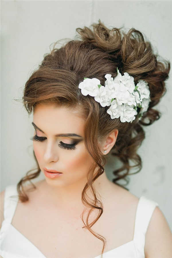 loose-wavy-wedding-updo-with-white-flower-headpiece