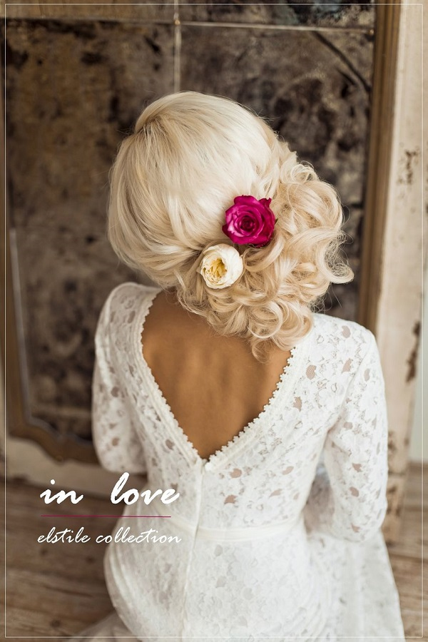 low-updo-hairstyle-for-werdding-with-white-and-red-flowers