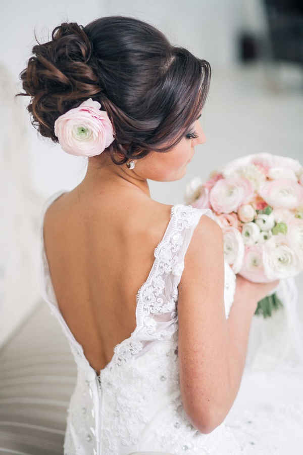 wedding-updo-hairstyle-with-pink-flower